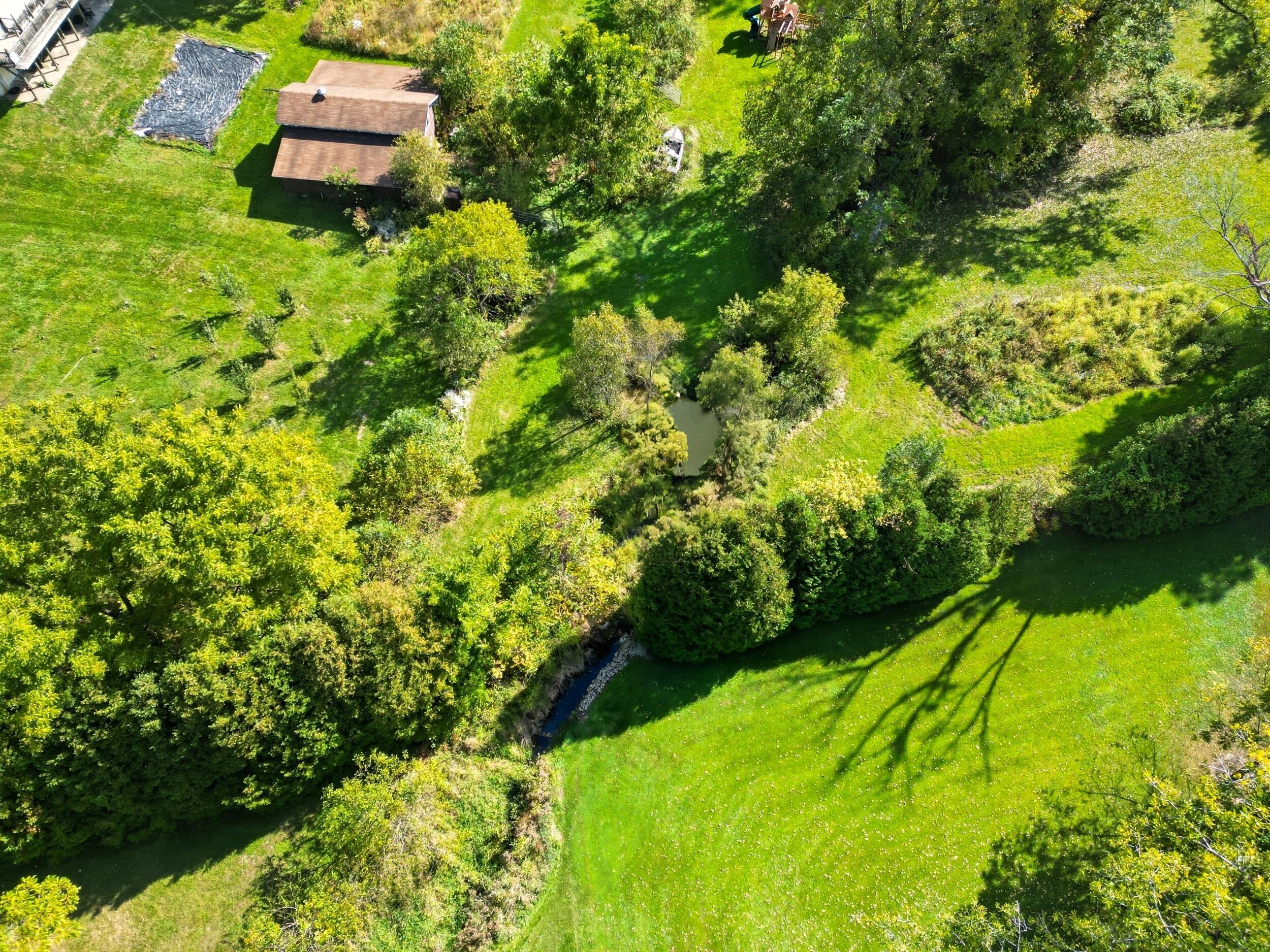 450 East Greening Road Chesterton, IN 46304 - Photo 41 of 56 a backyard of a house with lots of green space