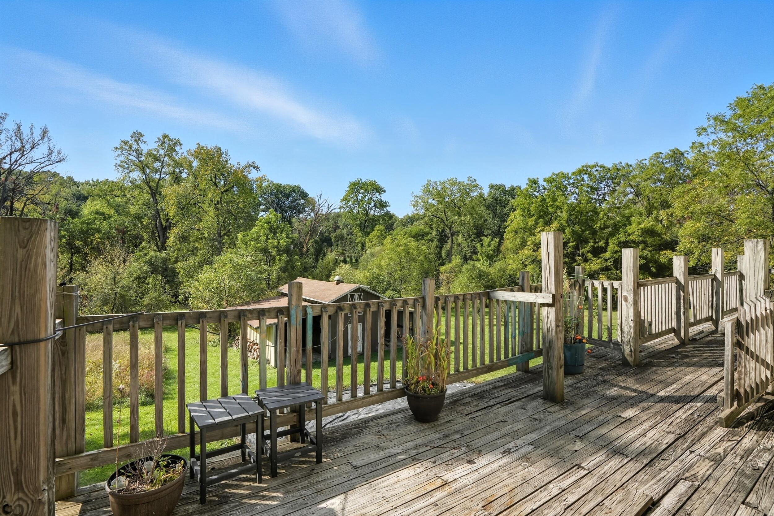 450 East Greening Road Chesterton, IN 46304 - Photo 50 of 56 a view of a wooden deck with a bench