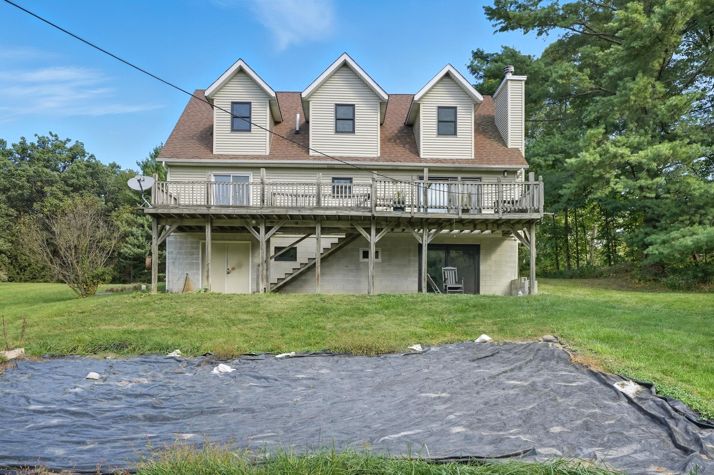 450 East Greening Road Chesterton, IN 46304 - Photo 55 of 56 a view of a big house with a big yard and large trees