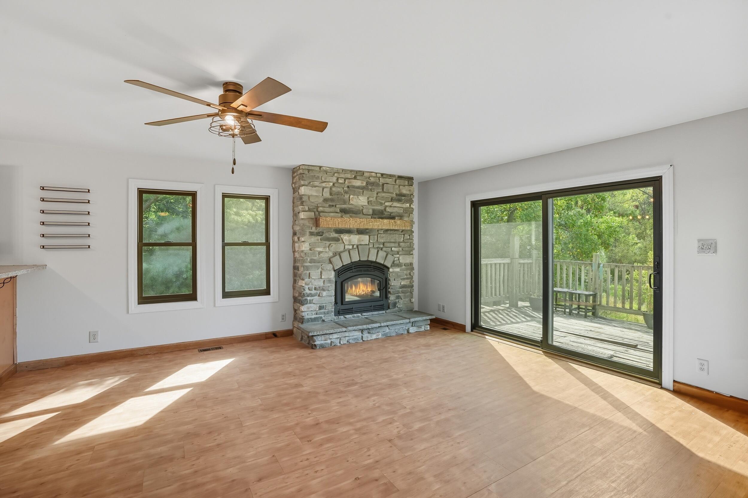 450 East Greening Road Chesterton, IN 46304 - Photo 8 of 56 a view of a livingroom with a fireplace and a ceiling fan
