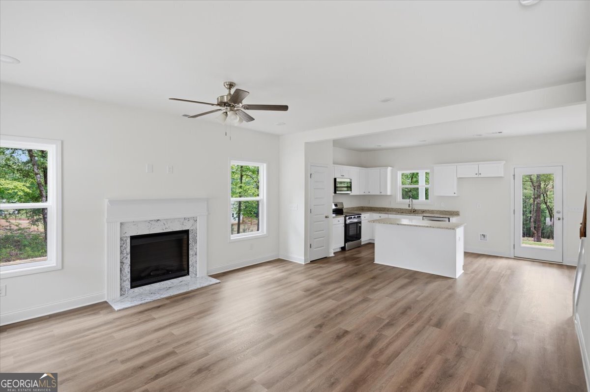 2778 Boxankle Road Forsyth, GA 31029 - Photo 2 of 21 a view of a kitchen with wooden floor and a fireplace