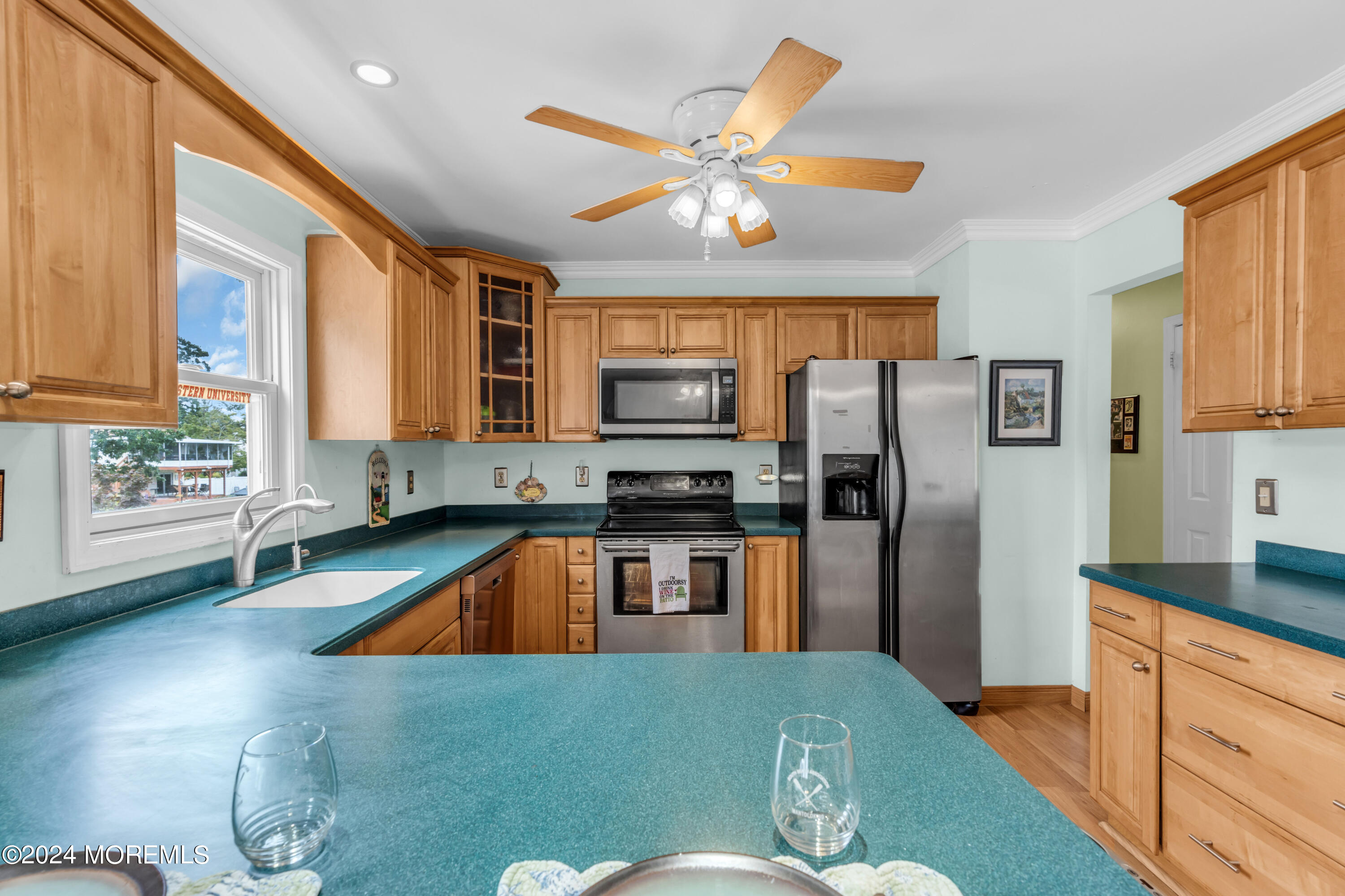 332 Emberly Road Brick, NJ 08723 - Photo 16 of 50 a kitchen with stainless steel appliances granite countertop a refrigerator a stove top oven a sink and dishwasher