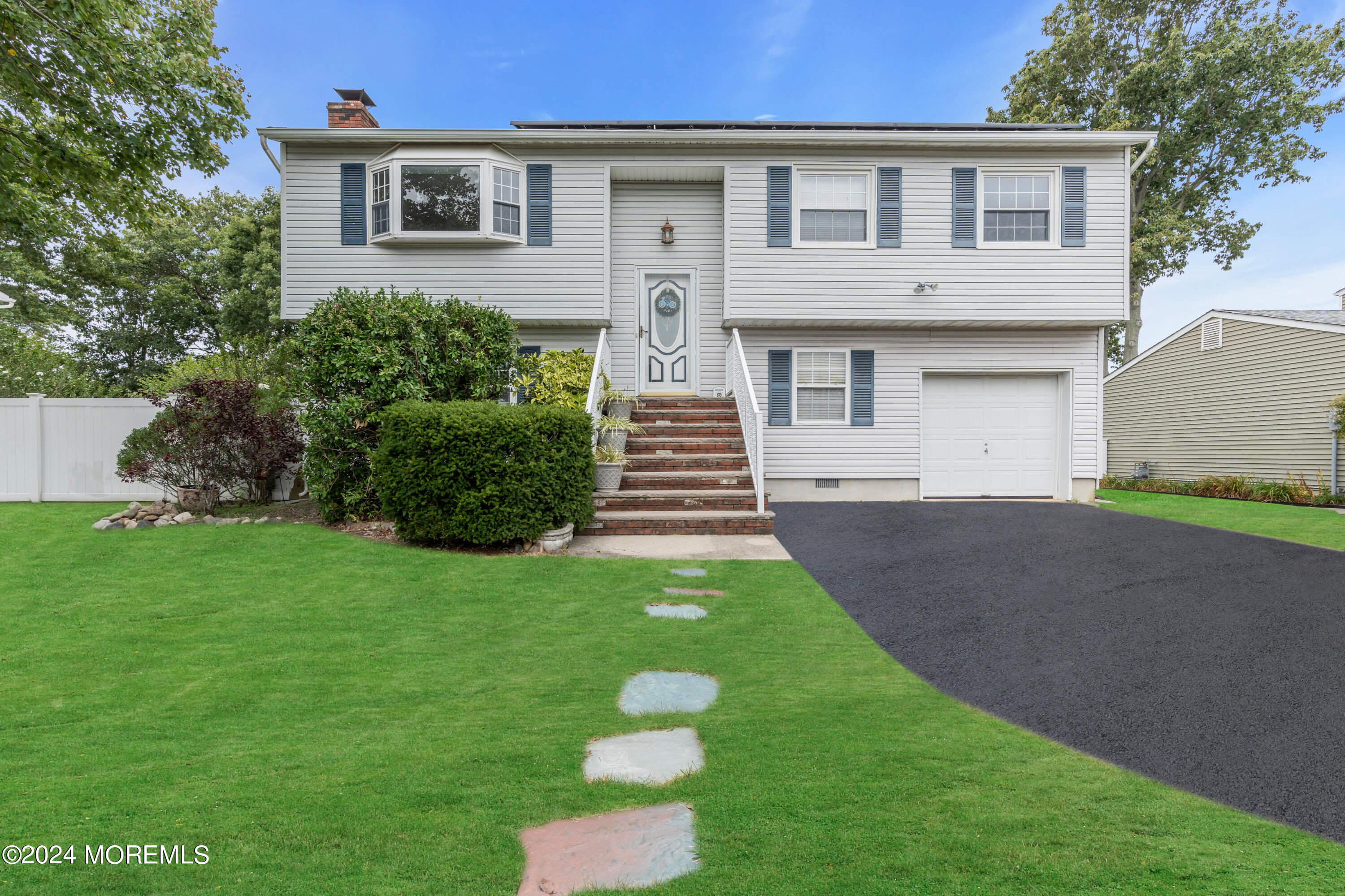 332 Emberly Road Brick, NJ 08723 - Photo 4 of 50 a front view of a house with garden