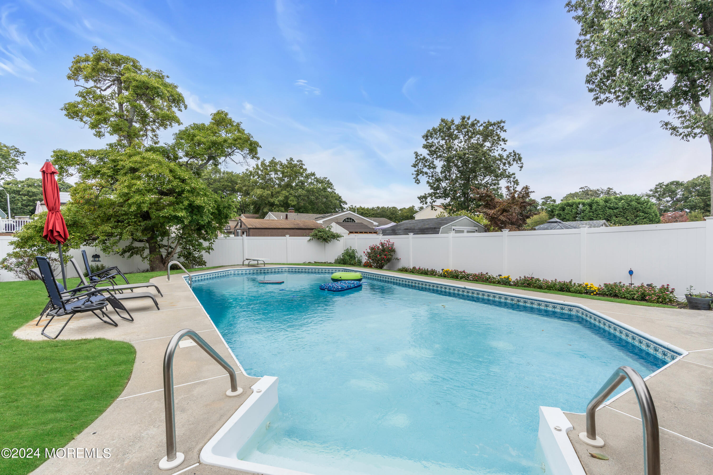 332 Emberly Road Brick, NJ 08723 - Photo 46 of 50 a view of a swimming pool with a yard