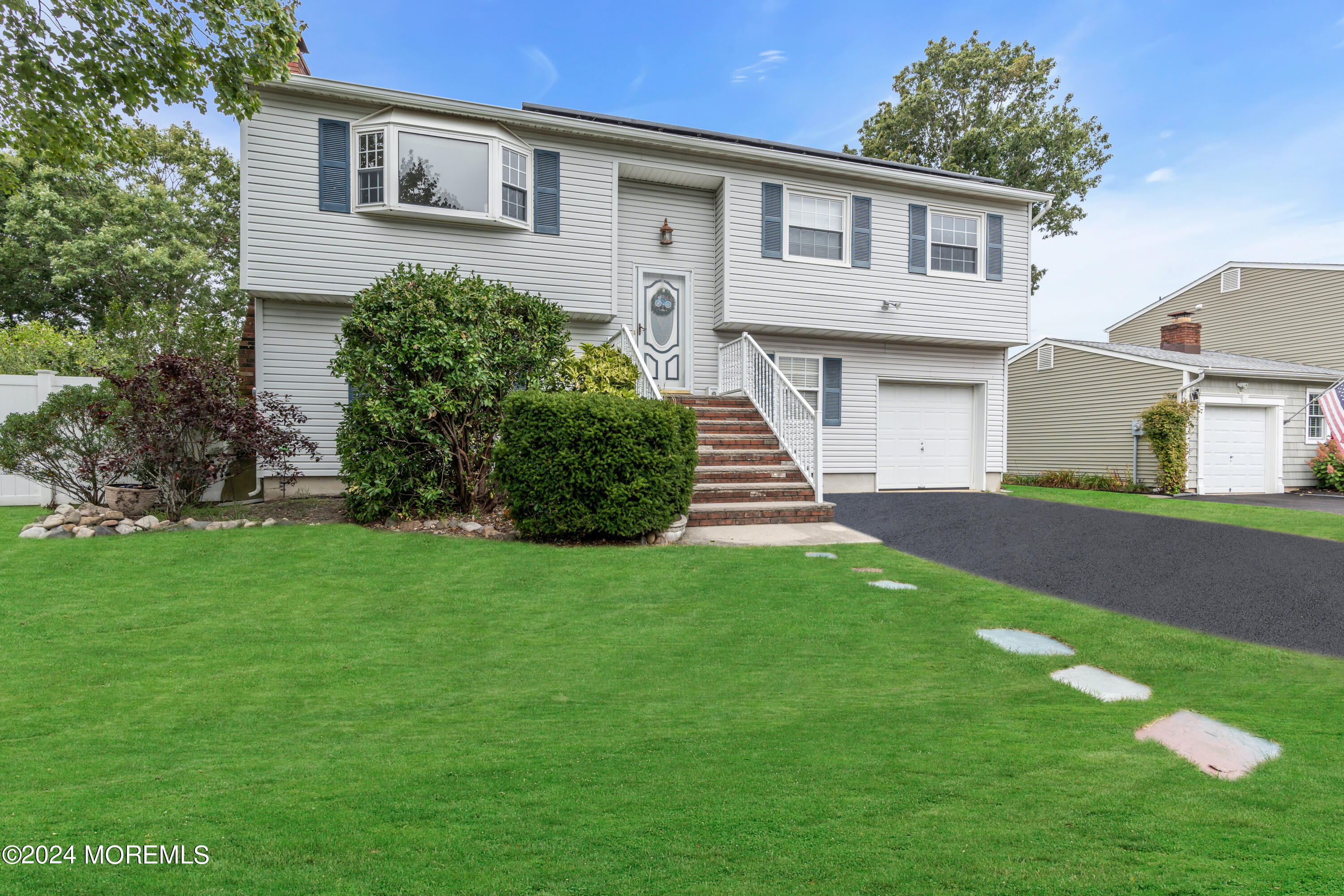 332 Emberly Road Brick, NJ 08723 - Photo 6 of 50 a front view of a house with a garden