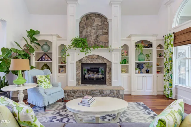 a kitchen with stainless steel appliances kitchen island granite countertop a stove a sink and a refrigerator