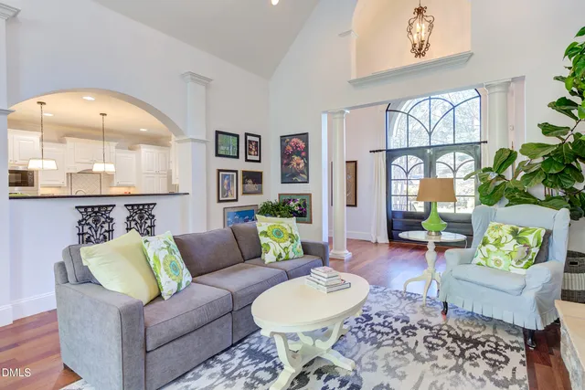 a kitchen with granite countertop a sink and refrigerator