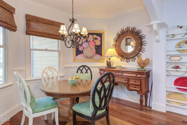 a living room with furniture fireplace and window