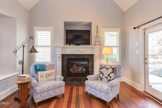 a bathroom with a granite countertop sink a mirror and a shower