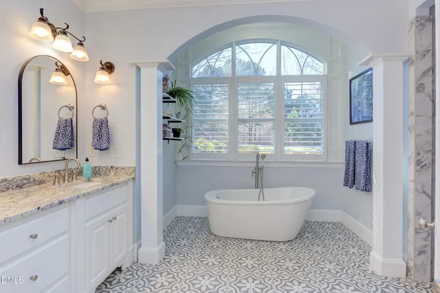 a bathroom with a sink a toilet and shower curtain