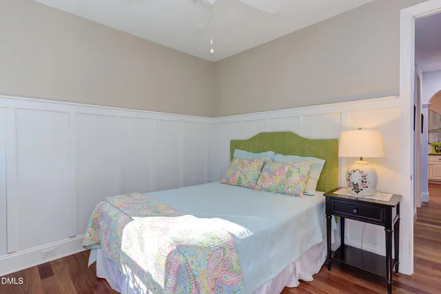 a view of a yard with plants and trees