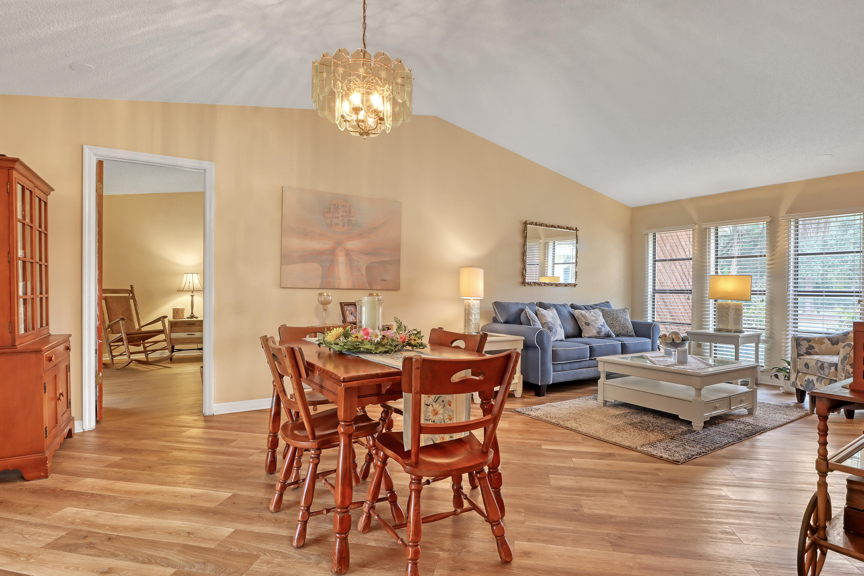 2160 Winston Drive Cocoa, FL 32926 - Photo 13 of 52 a view of a dining room with furniture wooden floor and chandelier