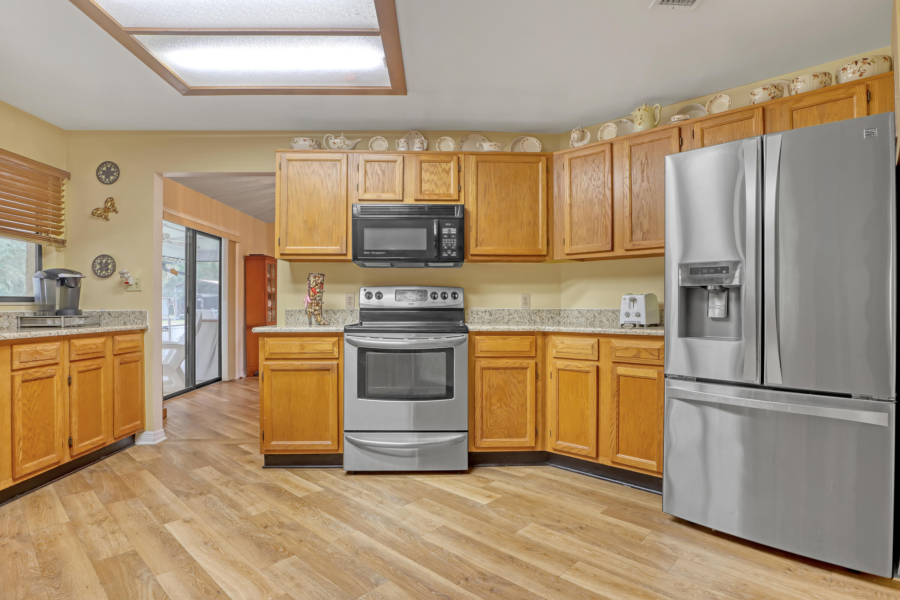2160 Winston Drive Cocoa, FL 32926 - Photo 14 of 52 a kitchen with a refrigerator stove and sink