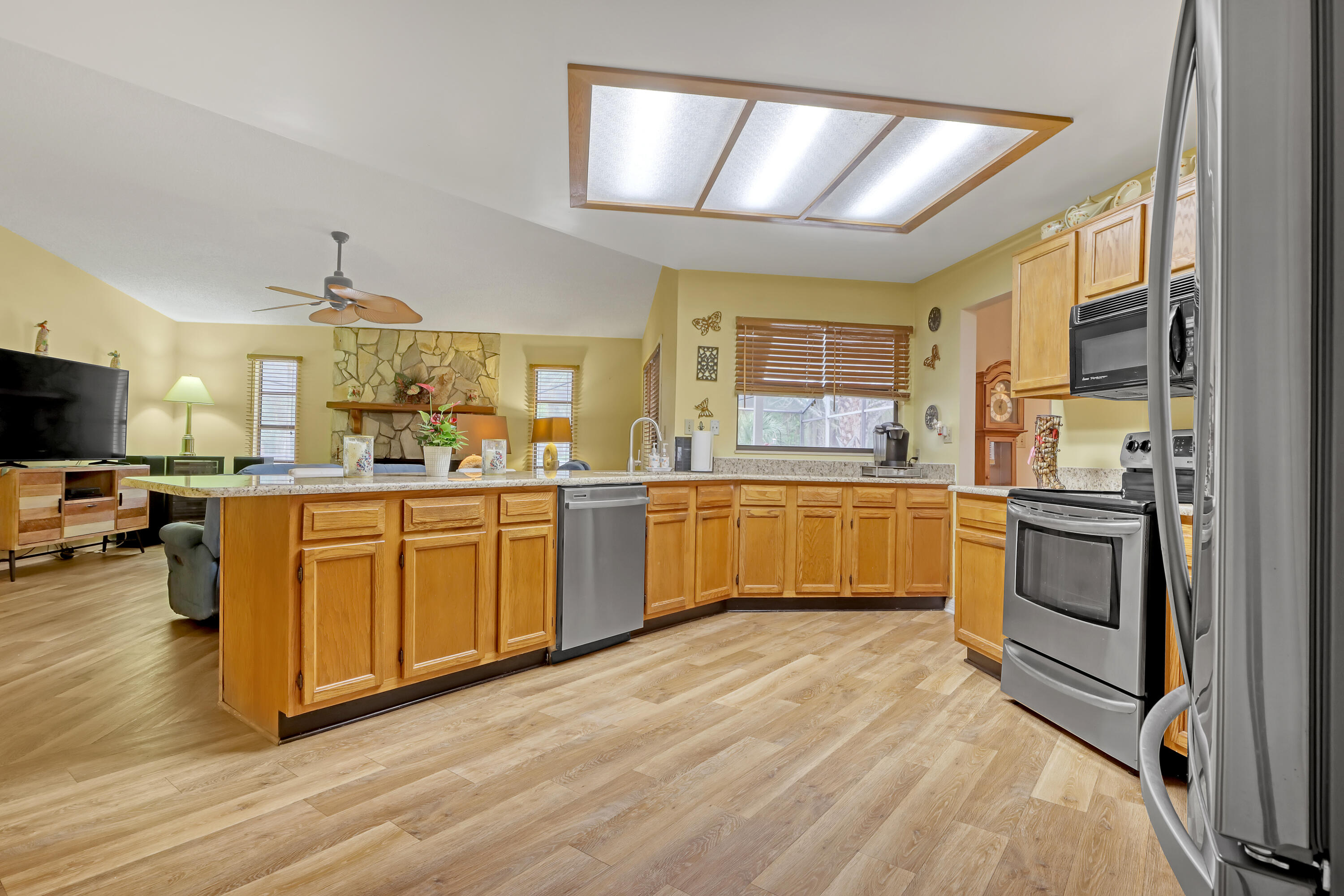 2160 Winston Drive Cocoa, FL 32926 - Photo 15 of 52 a kitchen with a sink appliances cabinets and a large window
