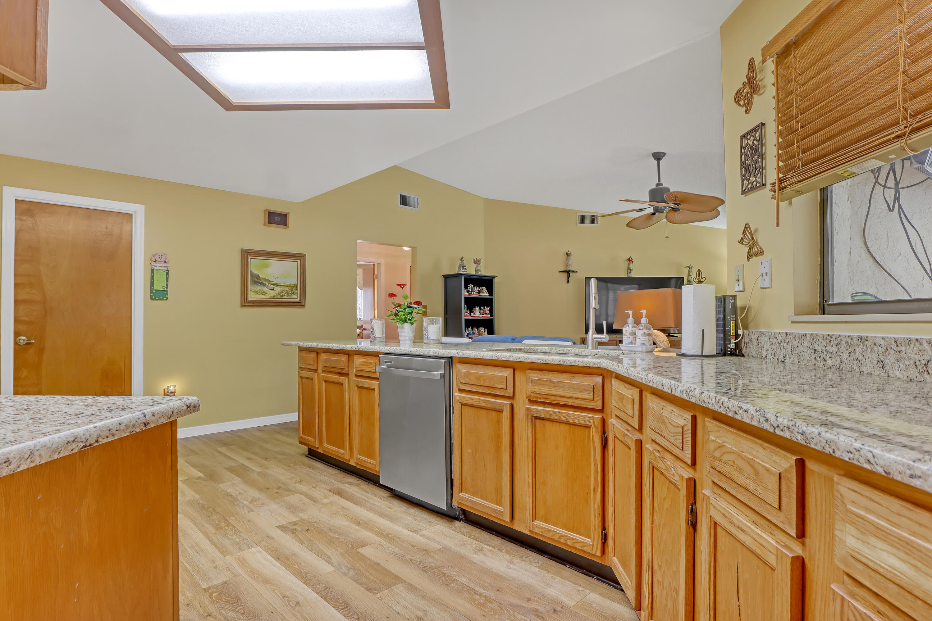 2160 Winston Drive Cocoa, FL 32926 - Photo 16 of 52 a kitchen with stainless steel appliances granite countertop a sink and dishwasher a stove with wooden floor