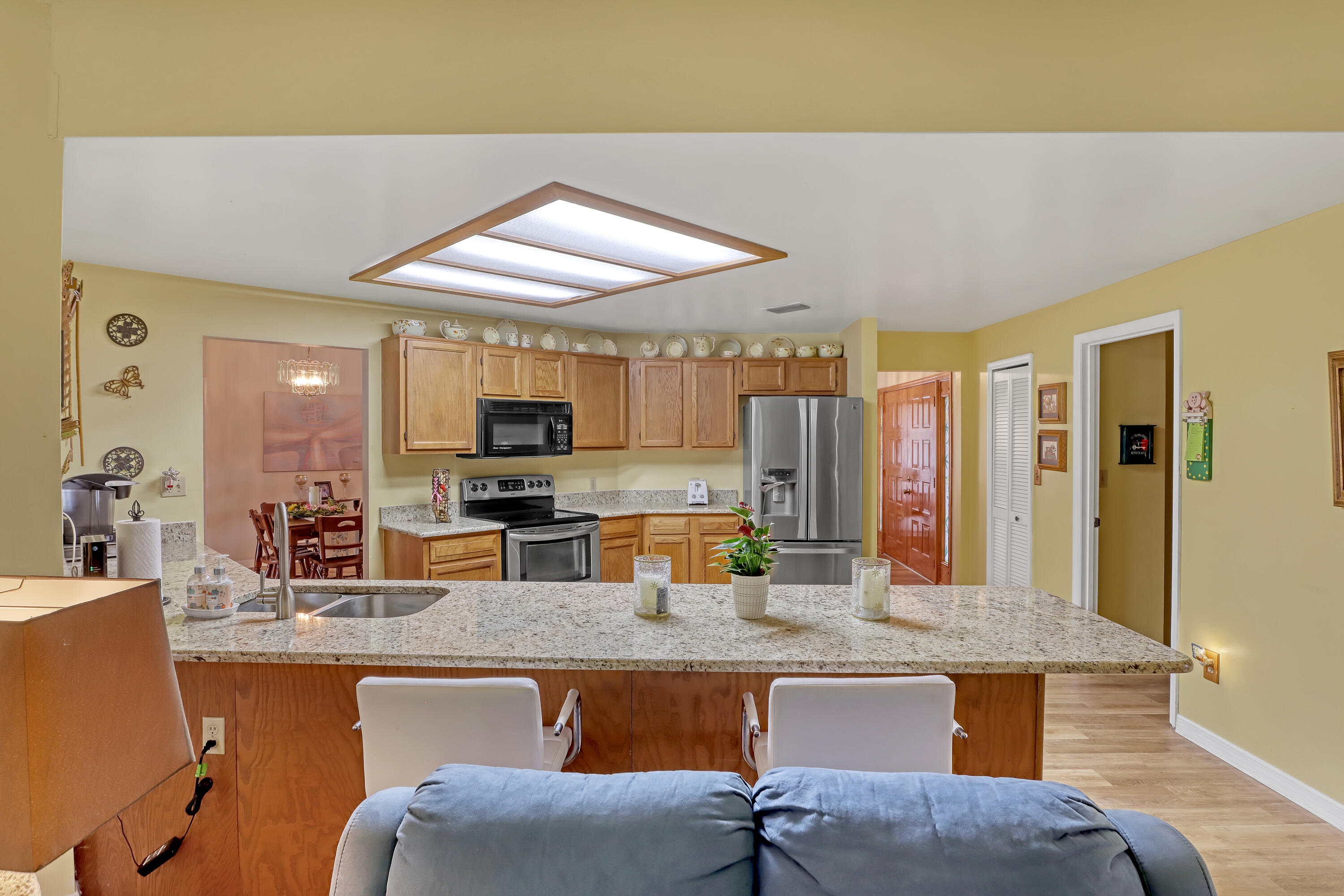 2160 Winston Drive Cocoa, FL 32926 - Photo 19 of 52 a kitchen with a table chairs and microwave