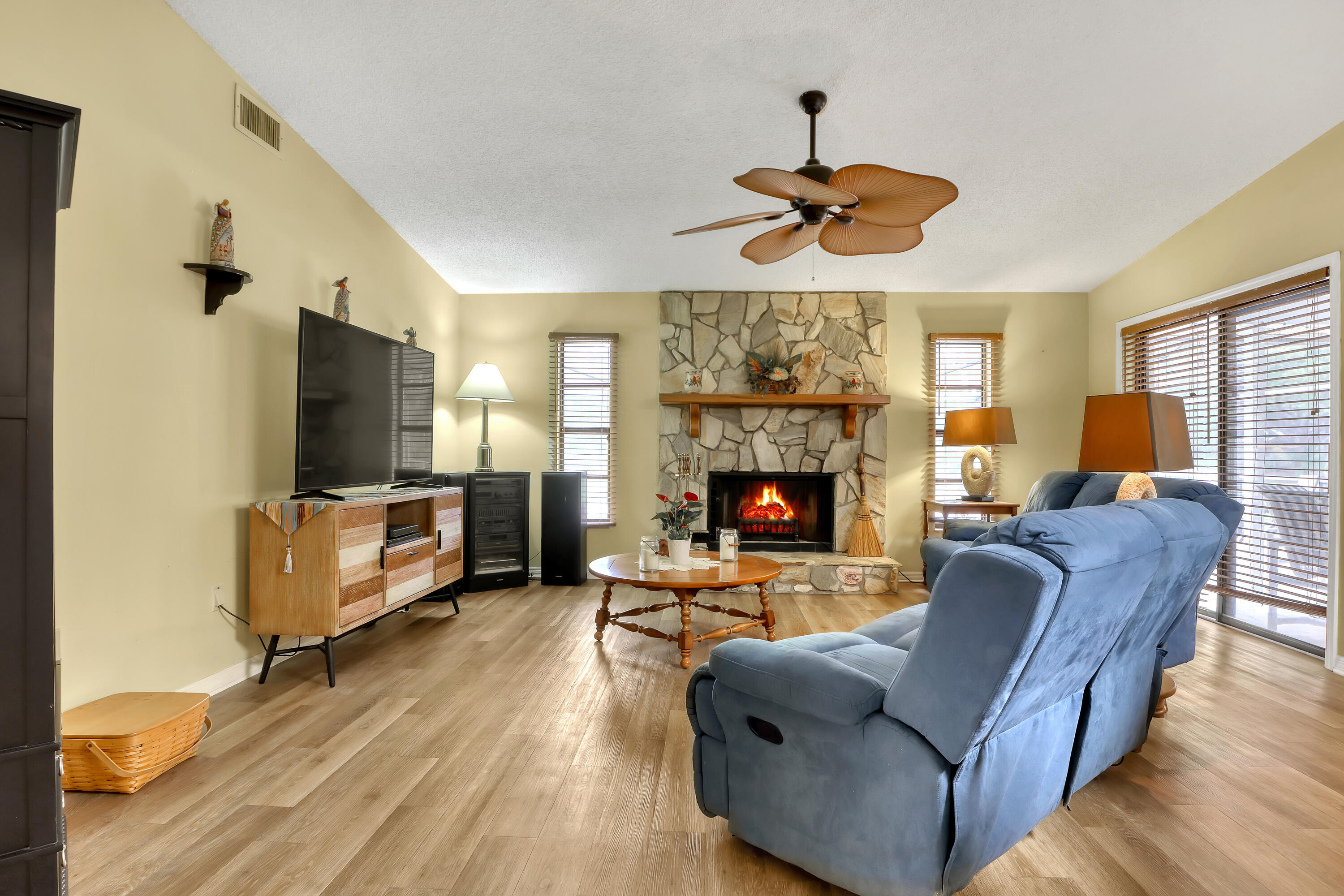 2160 Winston Drive Cocoa, FL 32926 - Photo 20 of 52 a living room with furniture a flat screen tv and a fireplace