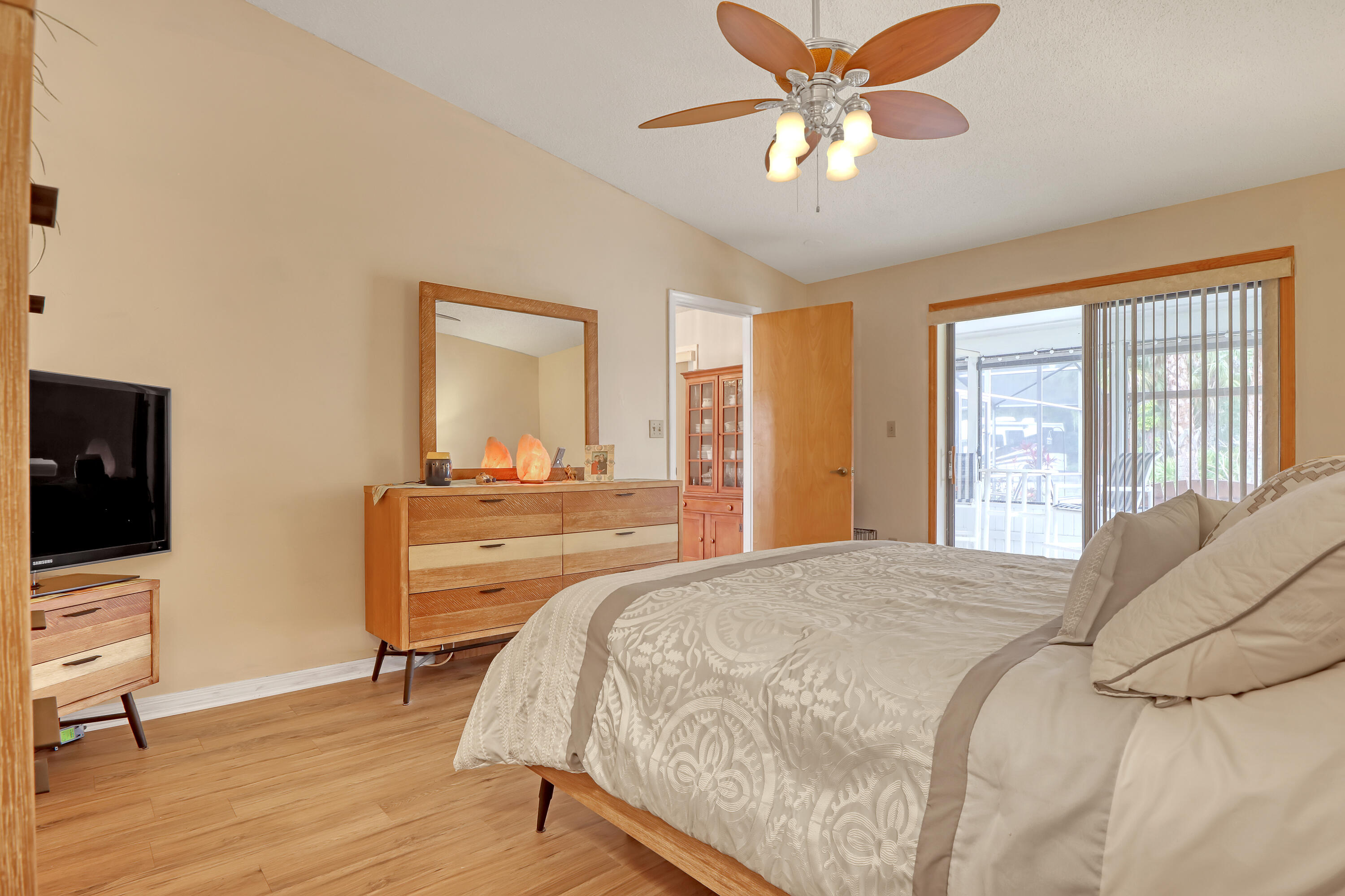 2160 Winston Drive Cocoa, FL 32926 - Photo 24 of 52 a bedroom with a bed and a flat screen tv