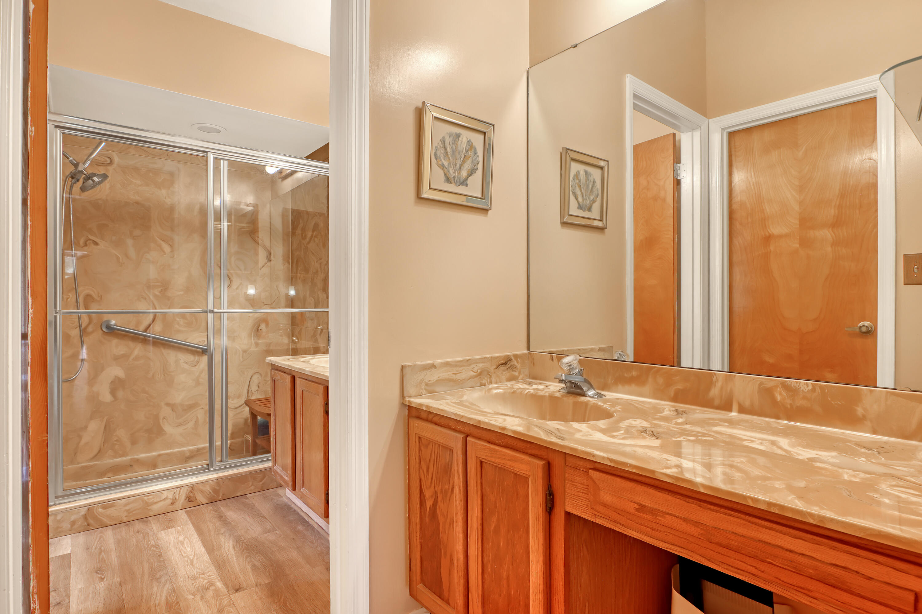 2160 Winston Drive Cocoa, FL 32926 - Photo 27 of 52 a bathroom with a granite countertop sink mirror and a shower
