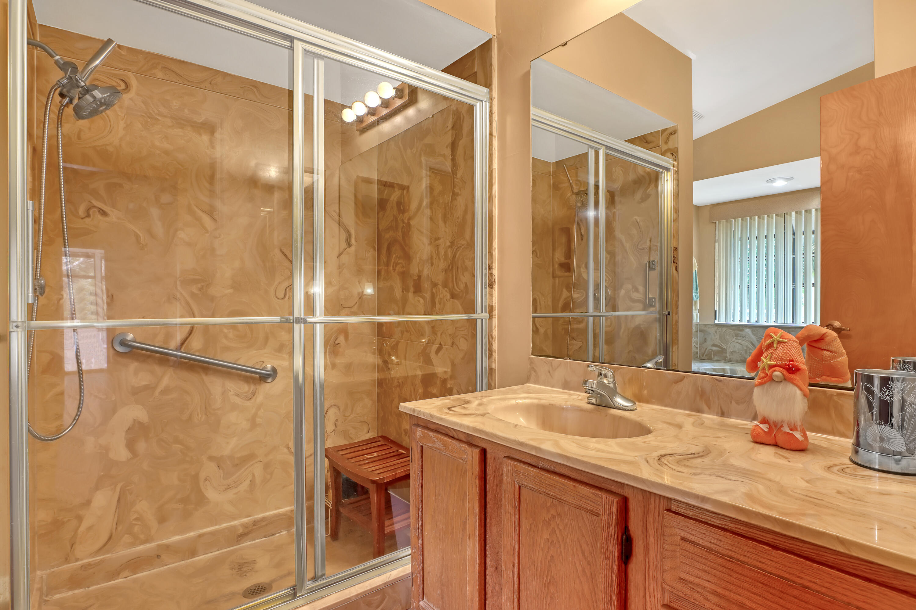 2160 Winston Drive Cocoa, FL 32926 - Photo 28 of 52 a bathroom with a sink and a mirror
