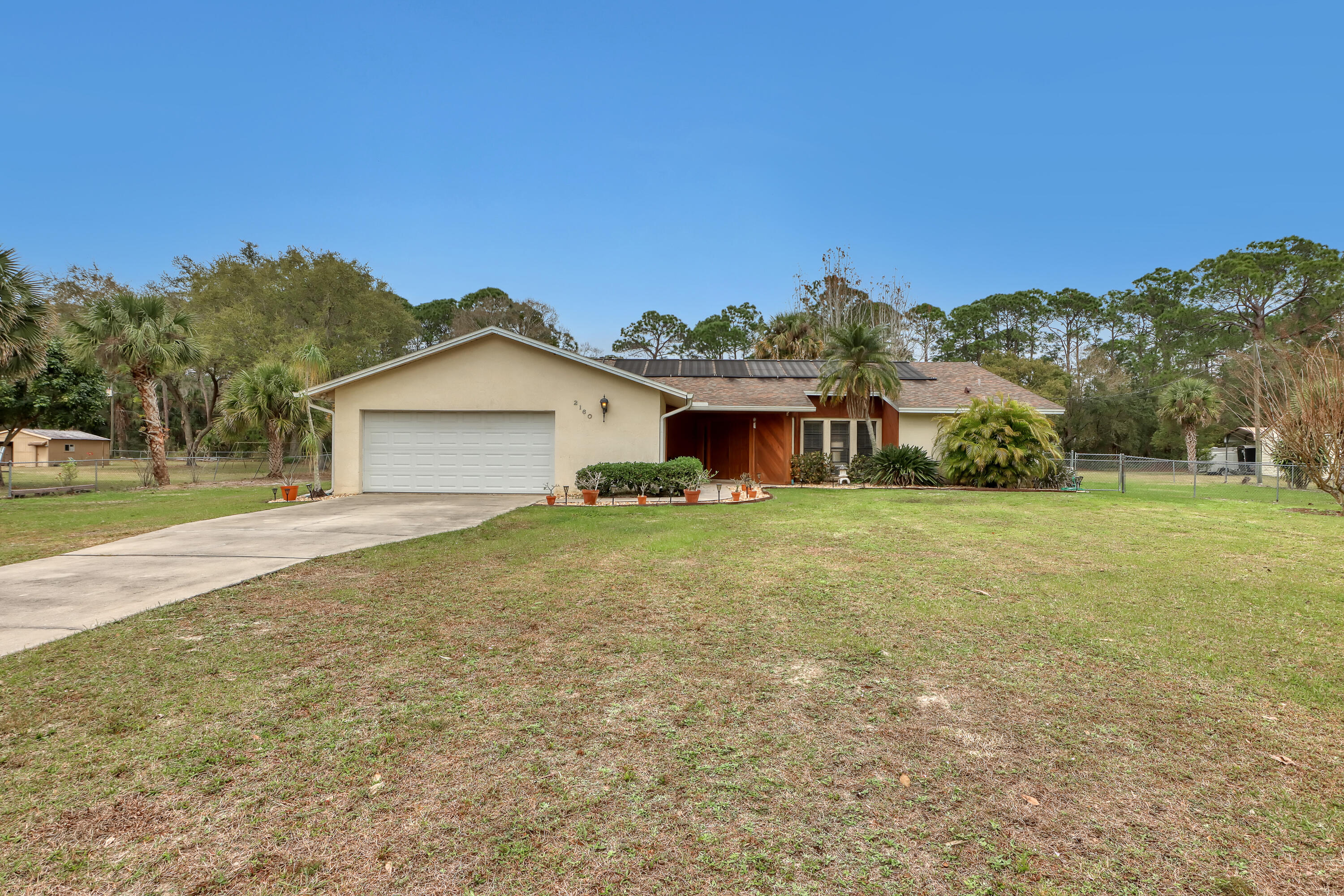 2160 Winston Drive Cocoa, FL 32926 - Photo 3 of 52 a front view of a house with garden