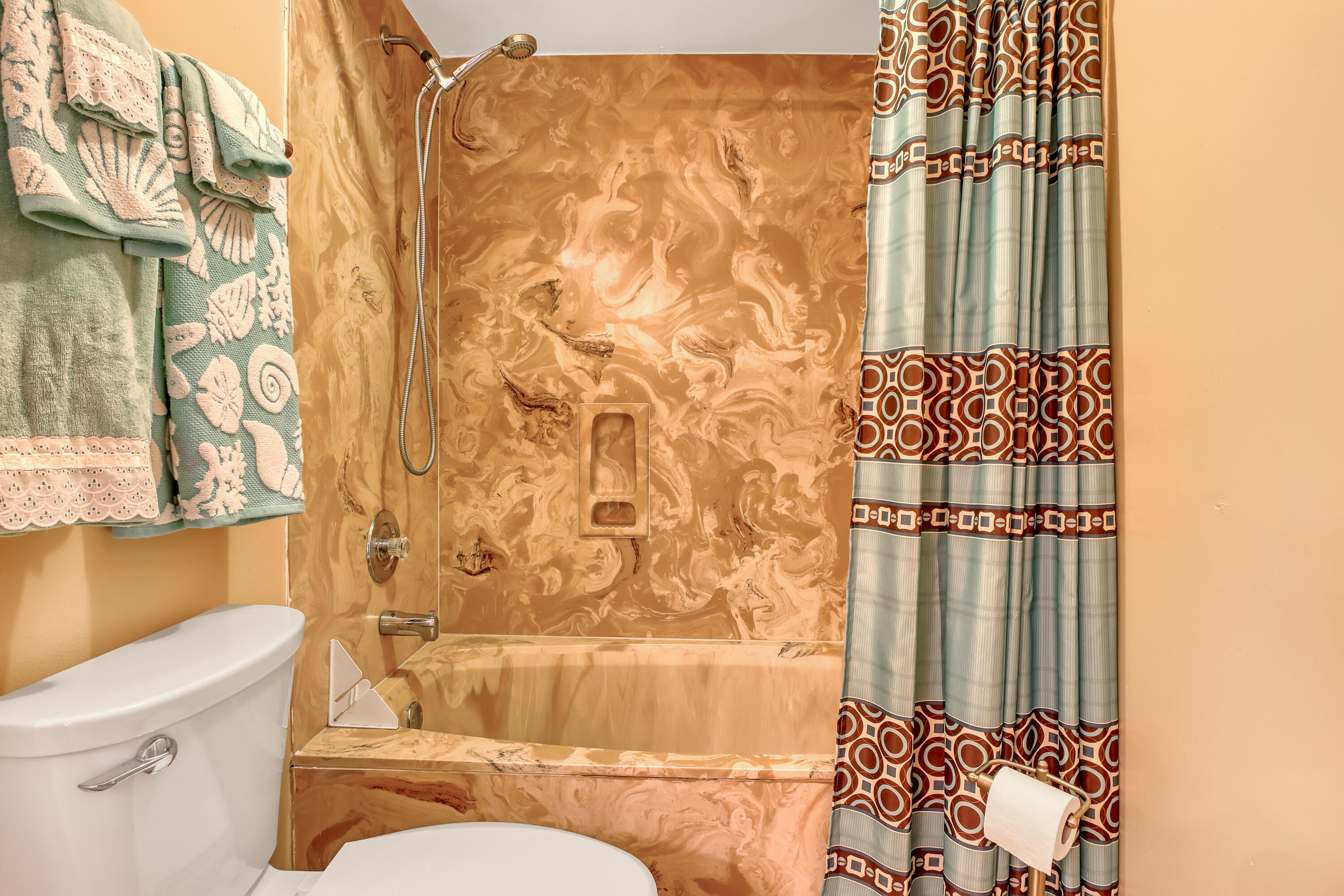 2160 Winston Drive Cocoa, FL 32926 - Photo 33 of 52 a bathroom with a toilet and a shower curtain