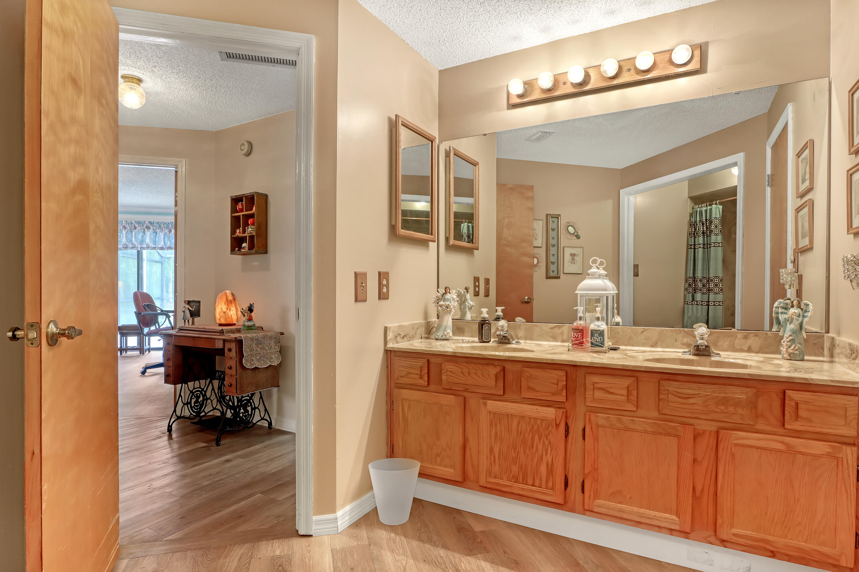 2160 Winston Drive Cocoa, FL 32926 - Photo 34 of 52 a en suite bathroom with double sink and a mirror