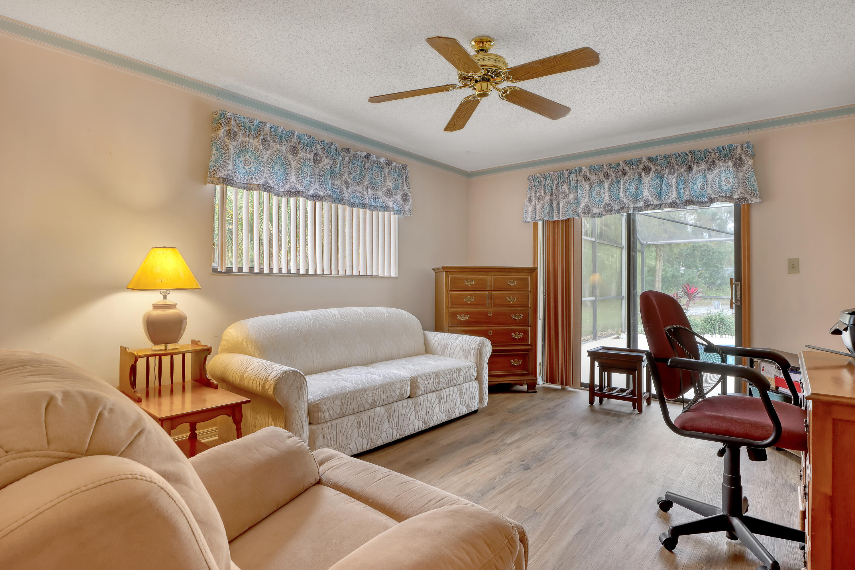 2160 Winston Drive Cocoa, FL 32926 - Photo 35 of 52 a bedroom with a bed and a chandelier