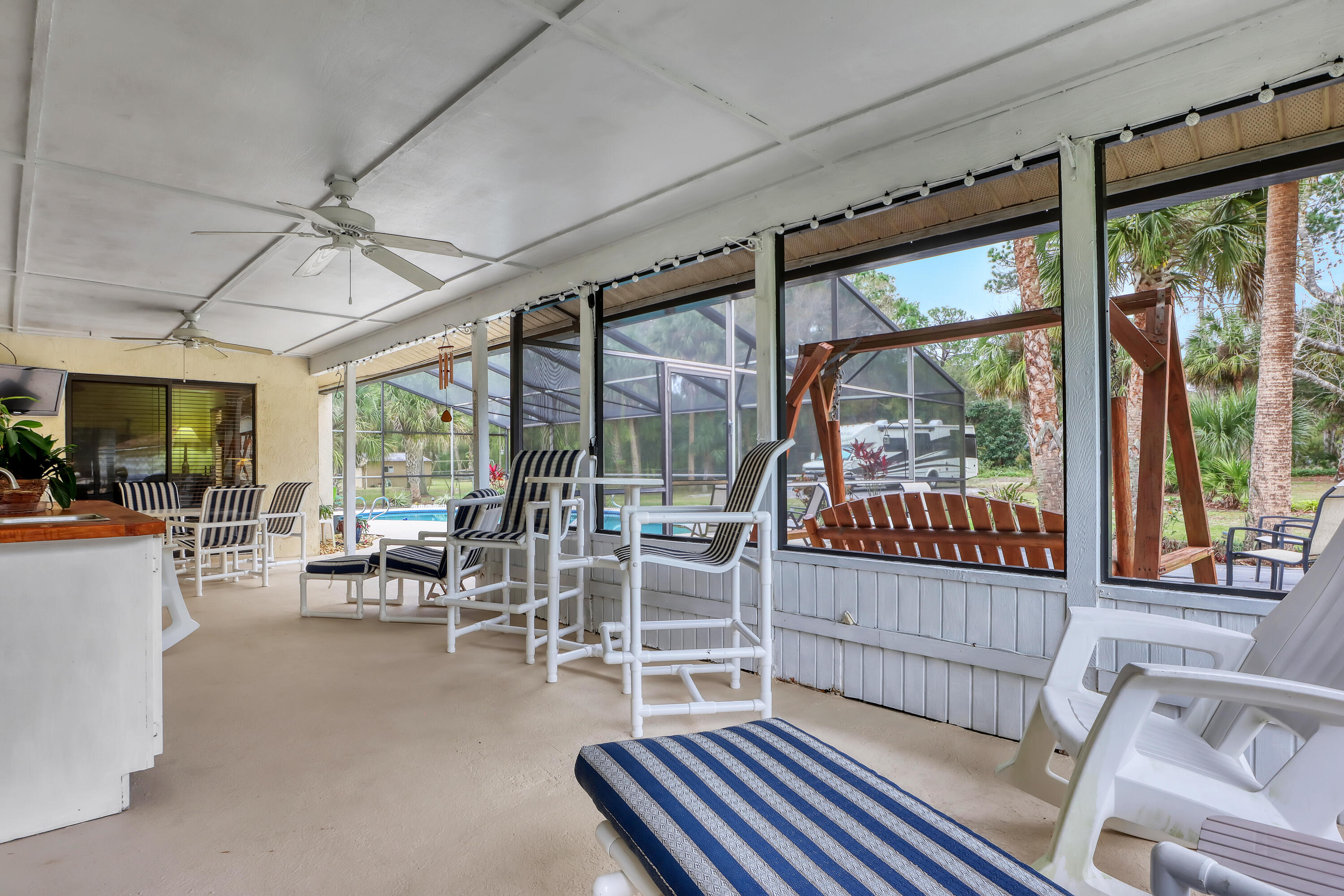 2160 Winston Drive Cocoa, FL 32926 - Photo 38 of 52 a living room with furniture and a large window