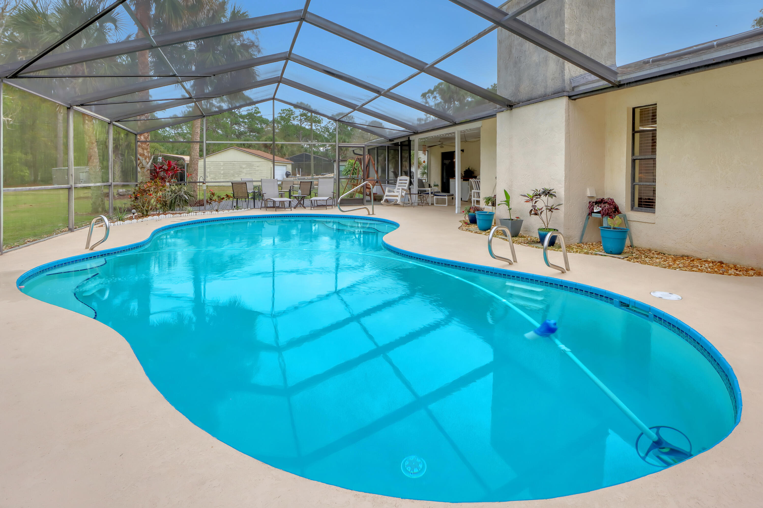 2160 Winston Drive Cocoa, FL 32926 - Photo 42 of 52 a view of a swimming pool with a patio