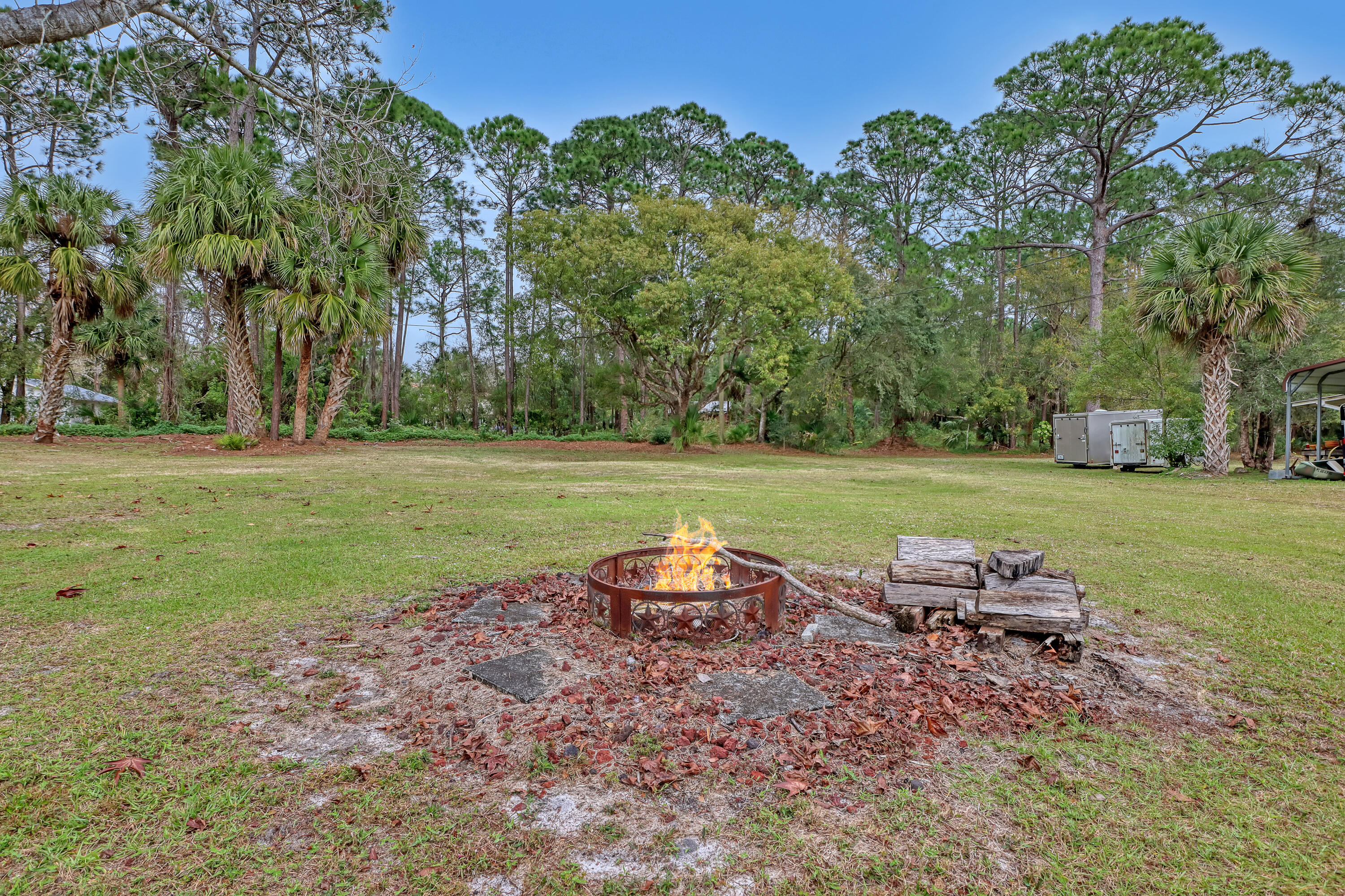 2160 Winston Drive Cocoa, FL 32926 - Photo 49 of 52 a backyard of a house with table and chairs
