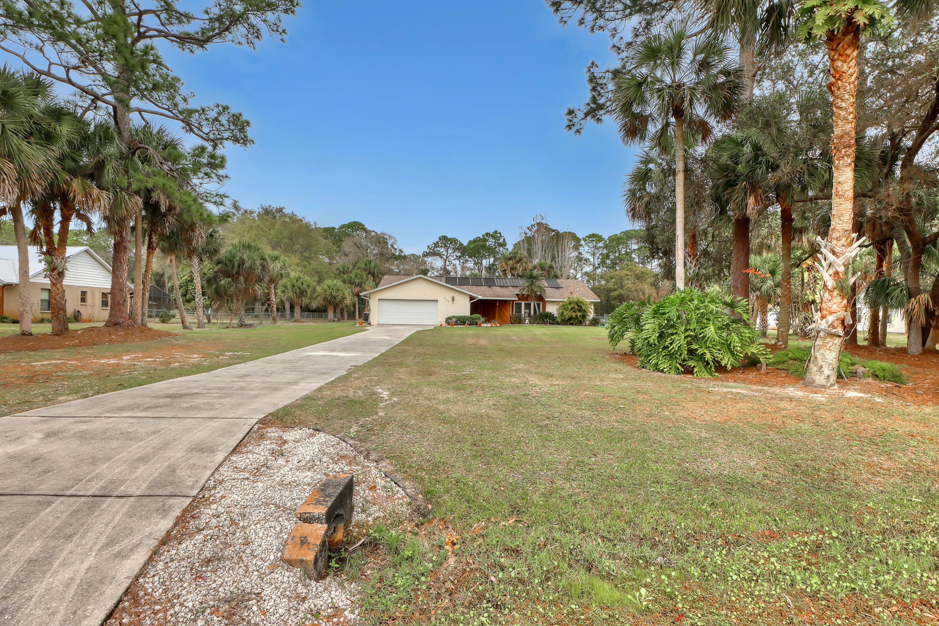 2160 Winston Drive Cocoa, FL 32926 - Photo 52 of 52 a view of a yard with an trees