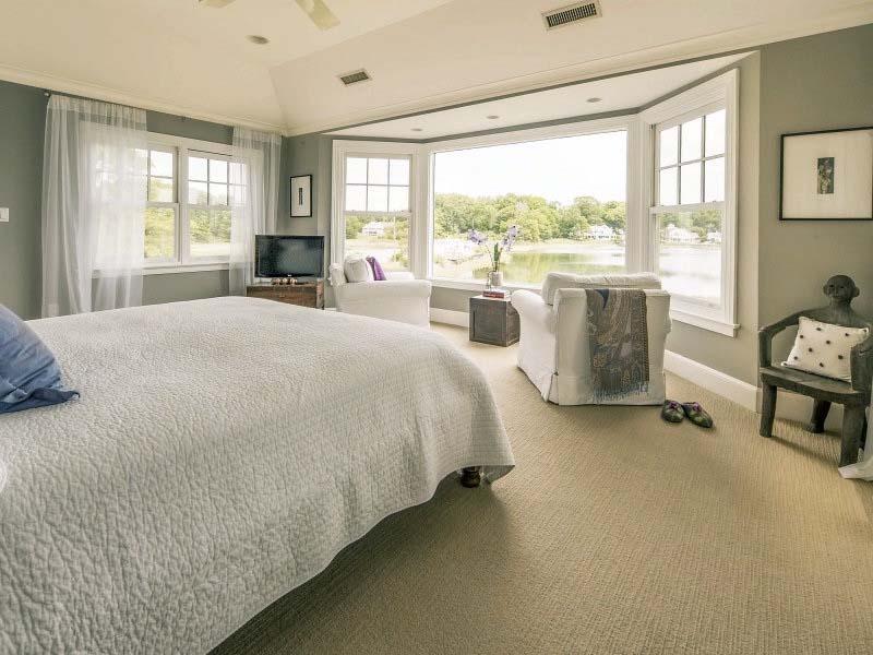 8 Nearwater Road Rowayton, CT 06853 - Photo 14 of 26 a spacious bedroom with a bed and a large window