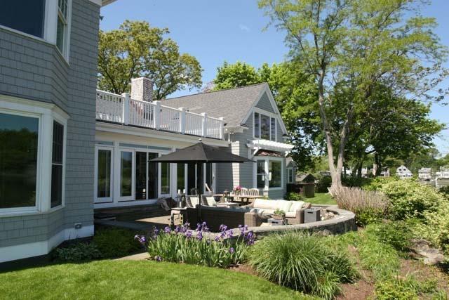 8 Nearwater Road Rowayton, CT 06853 - Photo 24 of 26 a front view of a house with a yard fountain and large tree