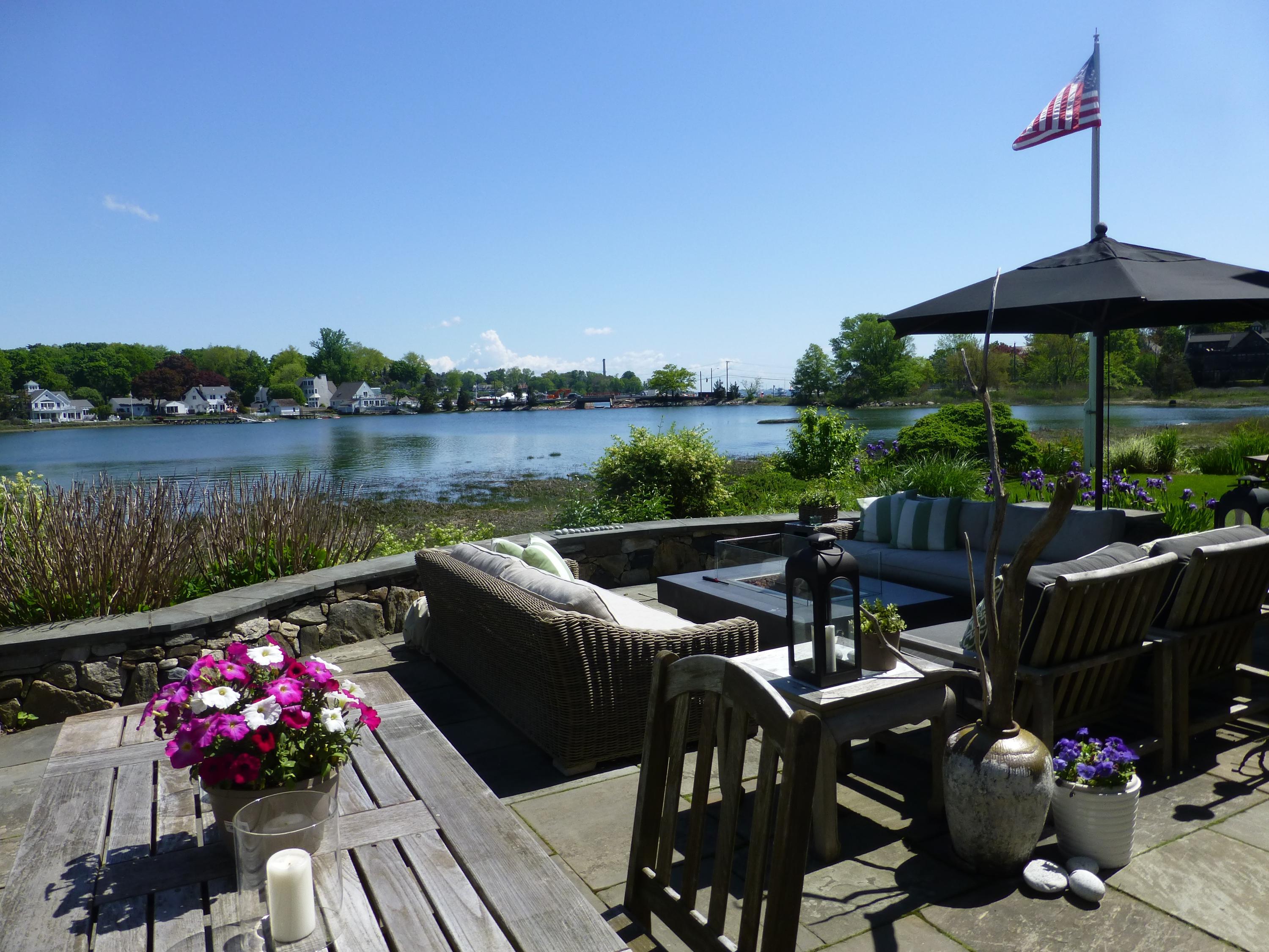 8 Nearwater Road Rowayton, CT 06853 - Photo 3 of 26 a view of a chairs and table in patio with a lake view