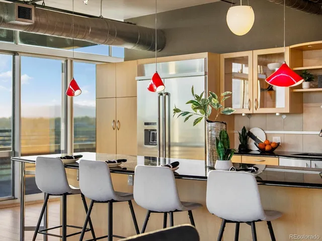 a kitchen with a table and chairs in it