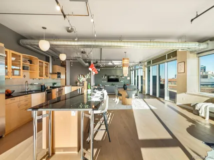 a view of a living room and kitchen