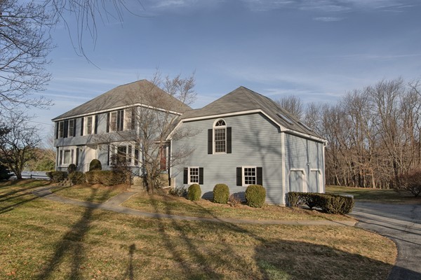37 Bailey Road Andover, MA 01810 - Photo 1 of 30 a view of a white house with a yard covered in snow