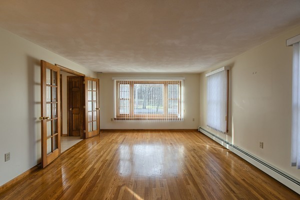 37 Bailey Road Andover, MA 01810 - Photo 13 of 30 a view of wooden floor and windows in a room