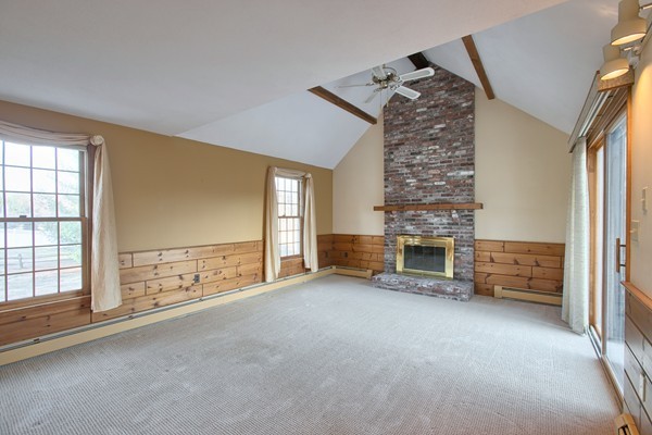 37 Bailey Road Andover, MA 01810 - Photo 14 of 30 an empty room with furniture and a fireplace
