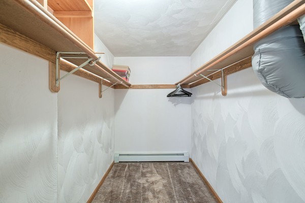 37 Bailey Road Andover, MA 01810 - Photo 19 of 30 a view of a room with racks on the wall