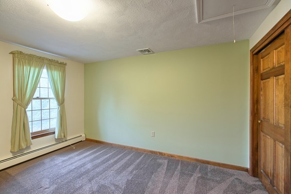 37 Bailey Road Andover, MA 01810 - Photo 22 of 30 an empty room with wooden floor and windows
