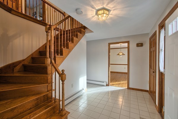 37 Bailey Road Andover, MA 01810 - Photo 10 of 30 a view of an entryway with wooden floor and stairs