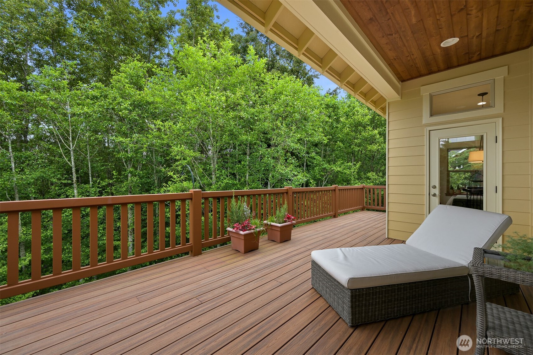 1910 40th Street Bellingham, WA 98229 - Photo 31 of 40 a balcony with wooden floor table and chairs