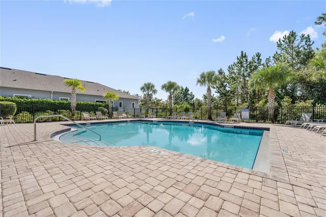 a view of a swimming pool with a lake view