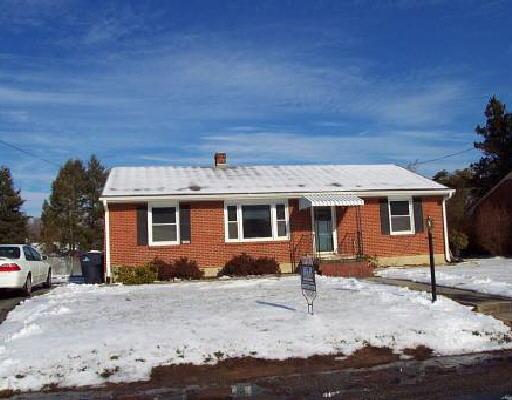 2009 Laura Road Northwest Roanoke, VA 24017 - Photo 1 of 1 a front view of a house with a yard
