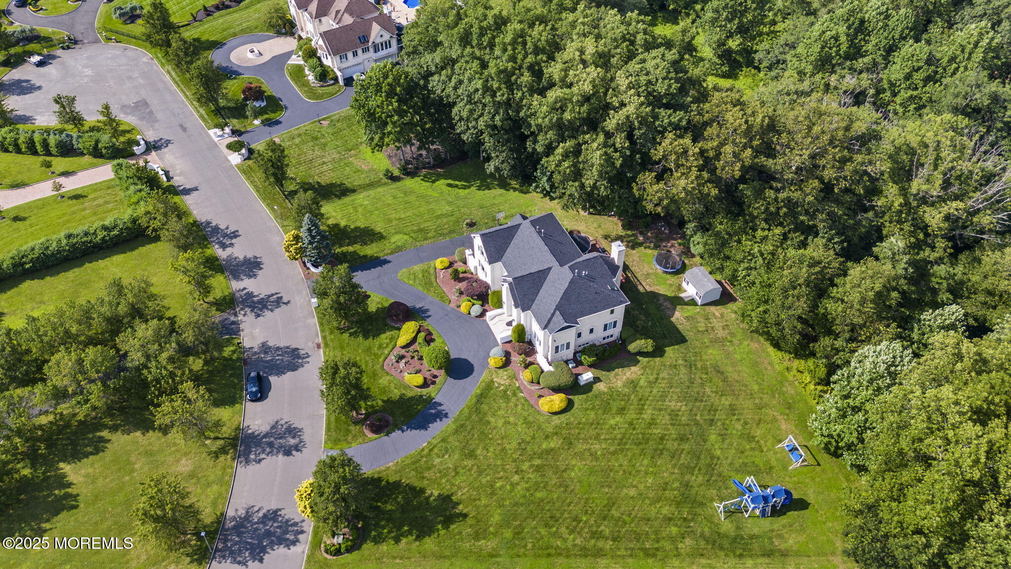 16 Shallow Brook Road Morganville, NJ 07751 - Photo 15 of 37 an aerial view of residential house with outdoor space and trees all around