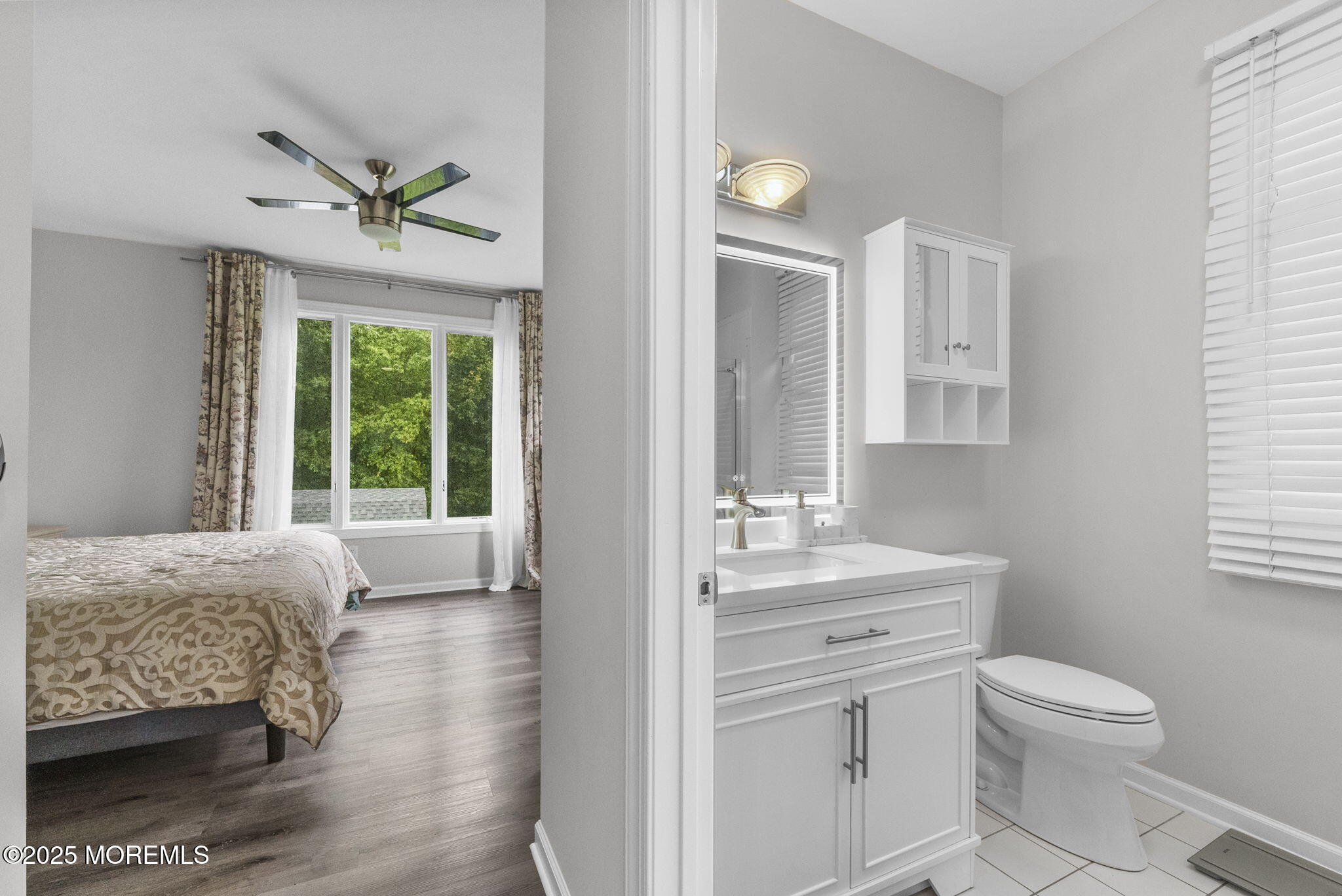 16 Shallow Brook Road Morganville, NJ 07751 - Photo 23 of 37 a spacious bathroom with a toilet a sink and a mirror