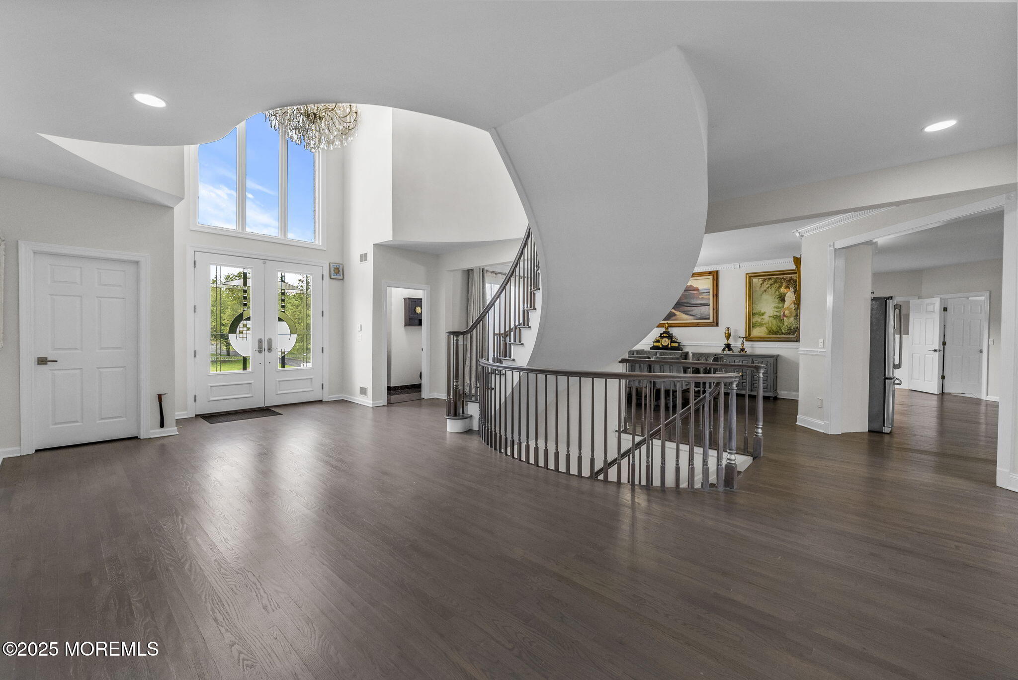 16 Shallow Brook Road Morganville, NJ 07751 - Photo 25 of 37 an empty room with wooden floor and windows