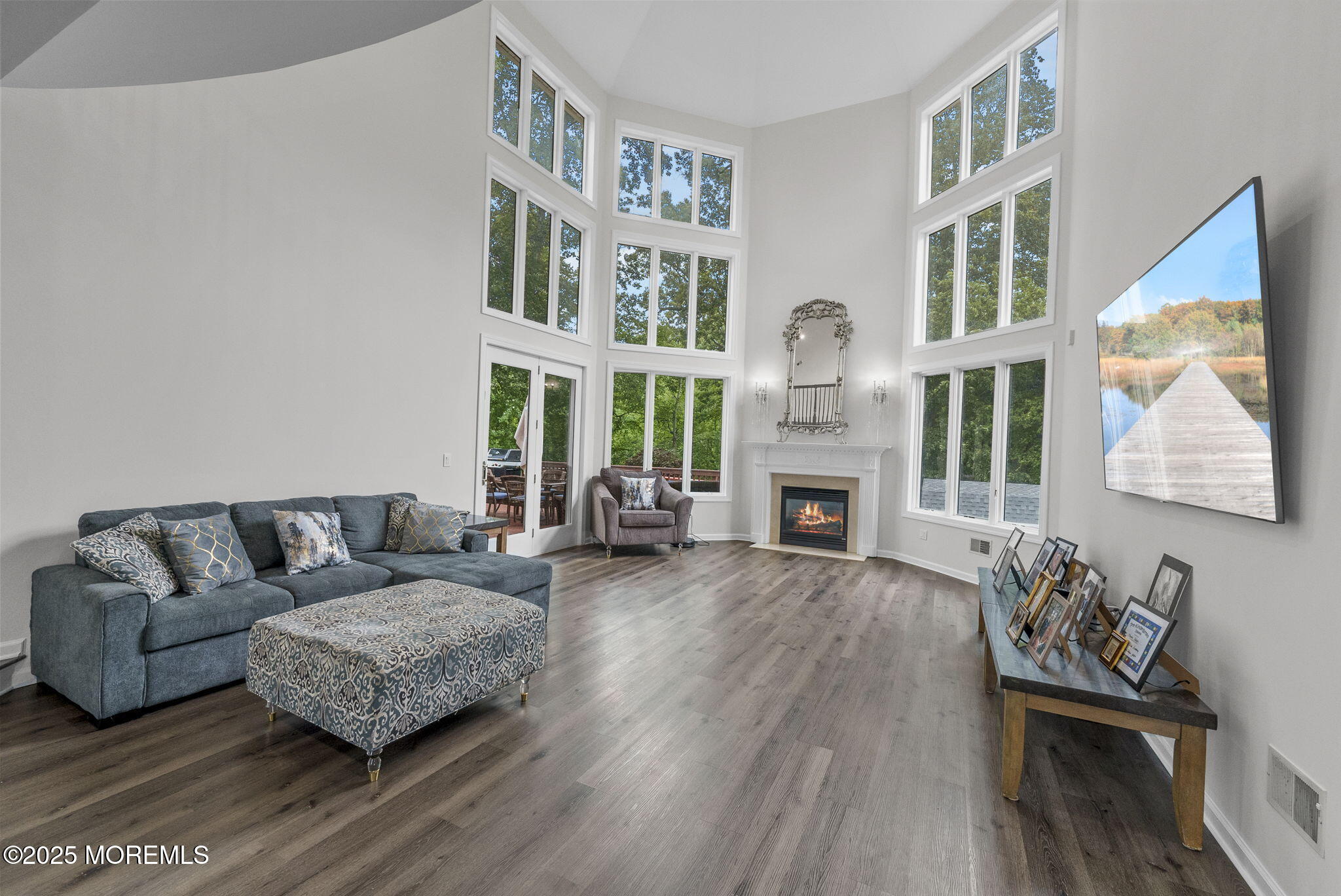 16 Shallow Brook Road Morganville, NJ 07751 - Photo 26 of 37 a living room with fireplace furniture and a wooden floor
